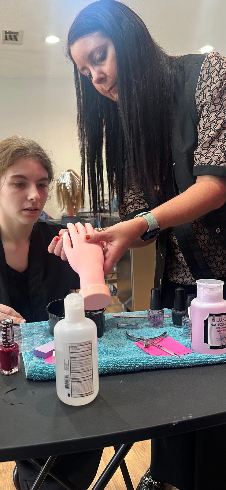 A Great Ambitions student practicing a manicure technique